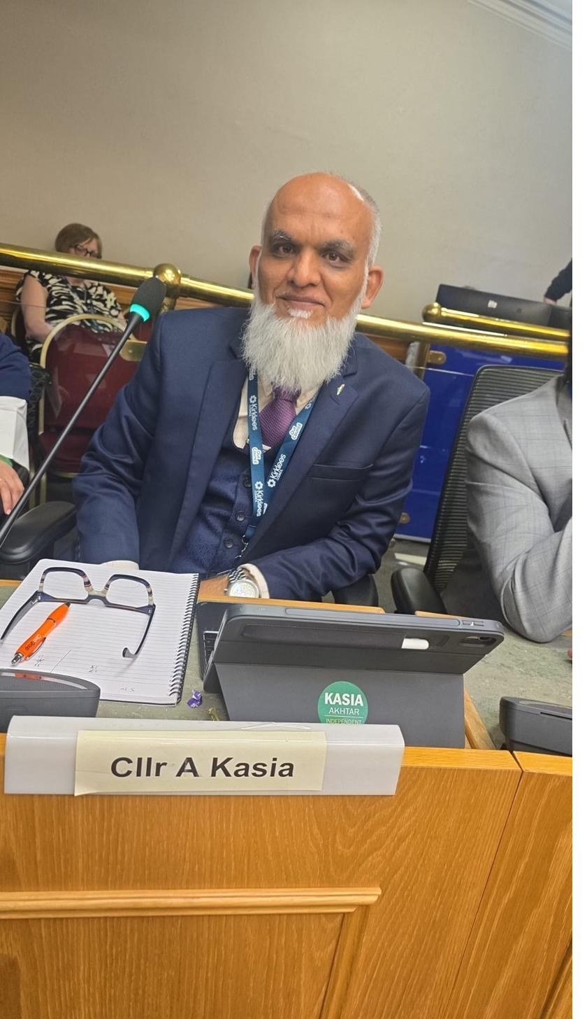 Councillor Akhtar Kasia at his seat in the council chamber