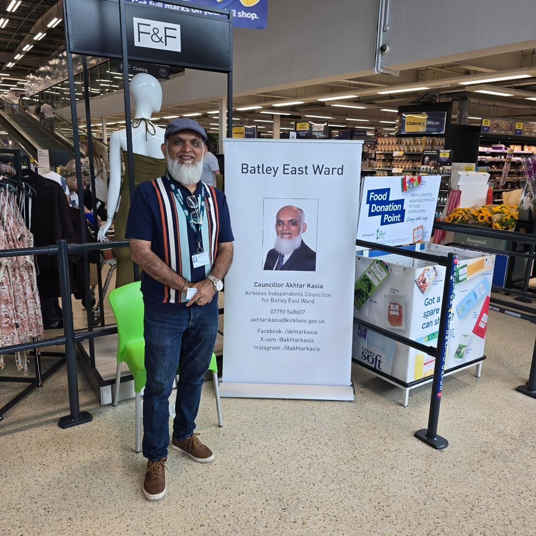 Councillor Akhtar Kasia at a Tesco surgery stand
